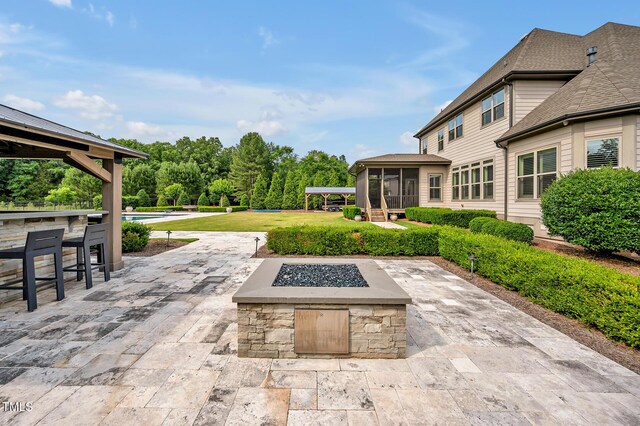 6250 Moinear Ln, Chapel Hill, NC 27514 - view of patio with a sunroom, an outdoor fire pit, and a swimming pool