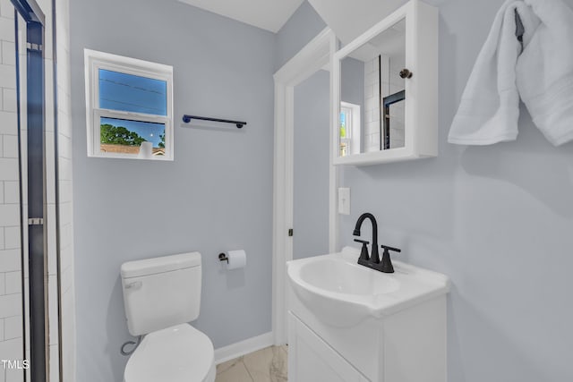 305 W Canary St, Dunn, NC 28334 - full bathroom with vanity, plenty of natural light, marble look tile flooring, and toilet