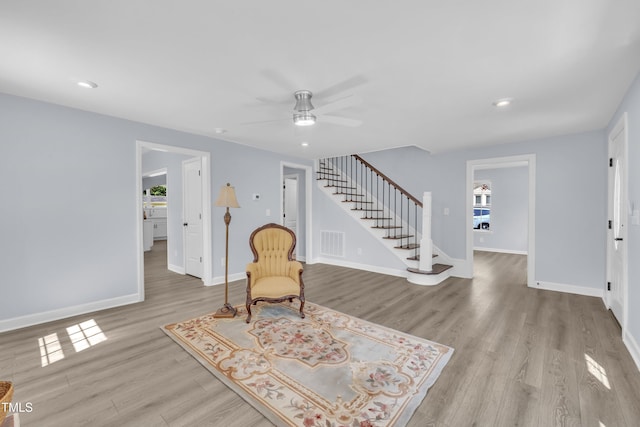 305 W Canary St, Dunn, NC 28334 - sitting room featuring stairway, wood finished floors, ceiling fan, baseboards, and recessed lighting