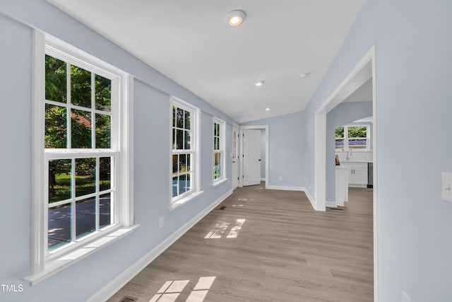 305 W Canary St, Dunn, NC 28334 - corridor featuring baseboards, lofted ceiling, light wood finished floors, and recessed lighting
