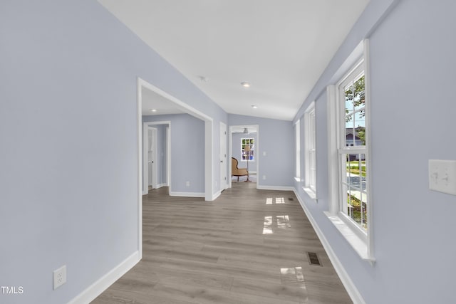 305 W Canary St, Dunn, NC 28334 - hallway with baseboards, light wood-style flooring, and lofted ceiling
