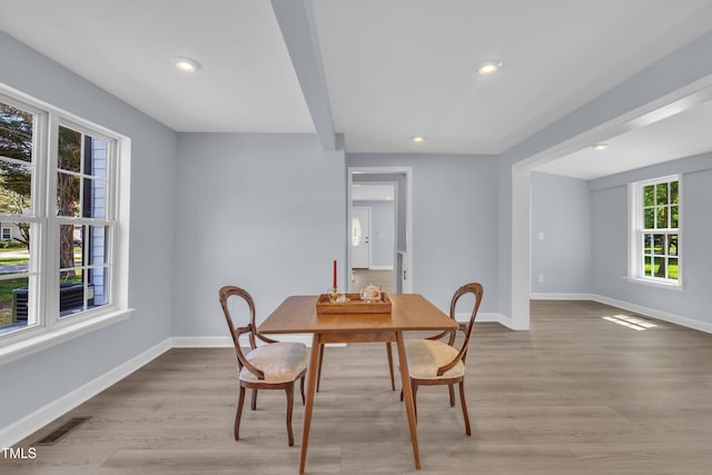 305 W Canary St, Dunn, NC 28334 - dining room featuring plenty of natural light, baseboards, light wood-style flooring, recessed lighting, and beamed ceiling