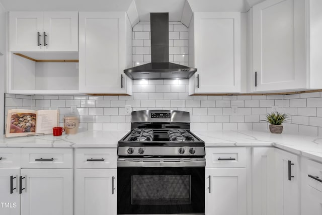 305 W Canary St, Dunn, NC 28334 - kitchen with gas stove, wall chimney range hood, white cabinets, and open shelves