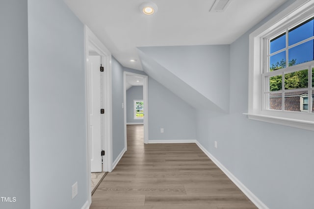 305 W Canary St, Dunn, NC 28334 - additional living space with recessed lighting, wood finished floors, vaulted ceiling, and baseboards