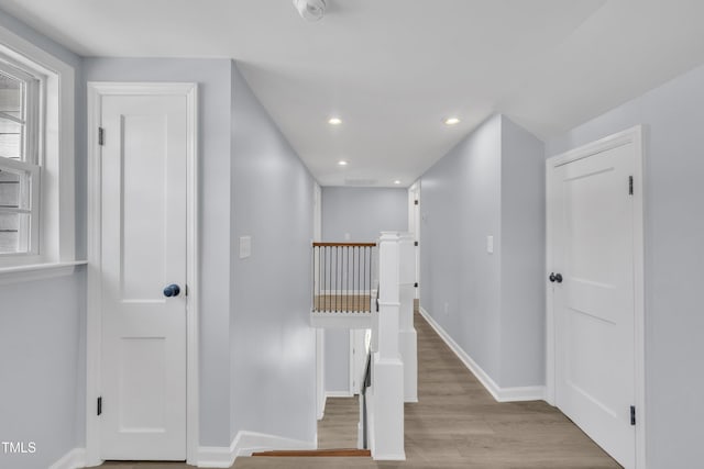 305 W Canary St, Dunn, NC 28334 - hallway with wood finished floors, recessed lighting, baseboards, and an upstairs landing