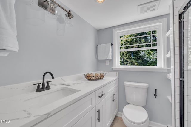 305 W Canary St, Dunn, NC 28334 - full bathroom featuring vanity, toilet, and a shower with shower door