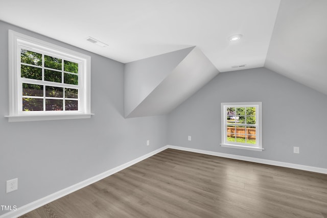 305 W Canary St, Dunn, NC 28334 - additional living space with wood finished floors, baseboards, lofted ceiling, and recessed lighting