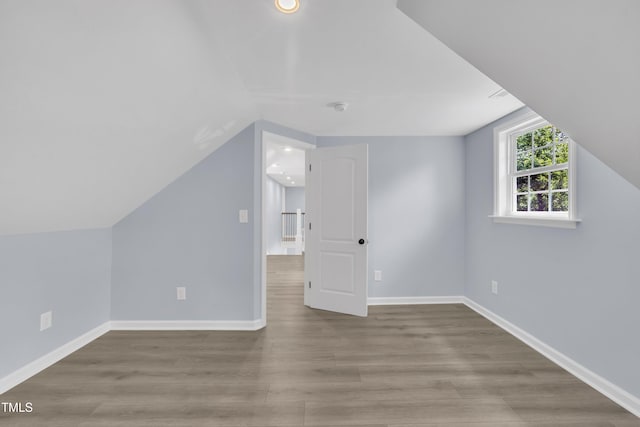 305 W Canary St, Dunn, NC 28334 - additional living space featuring lofted ceiling, wood finished floors, baseboards, and recessed lighting