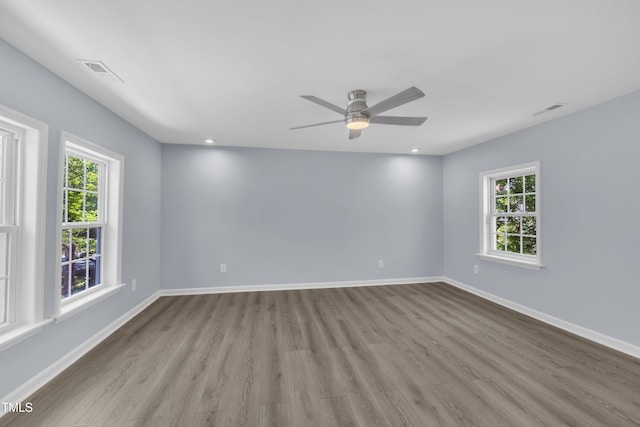 305 W Canary St, Dunn, NC 28334 - unfurnished room with wood finished floors, ceiling fan, baseboards, and recessed lighting