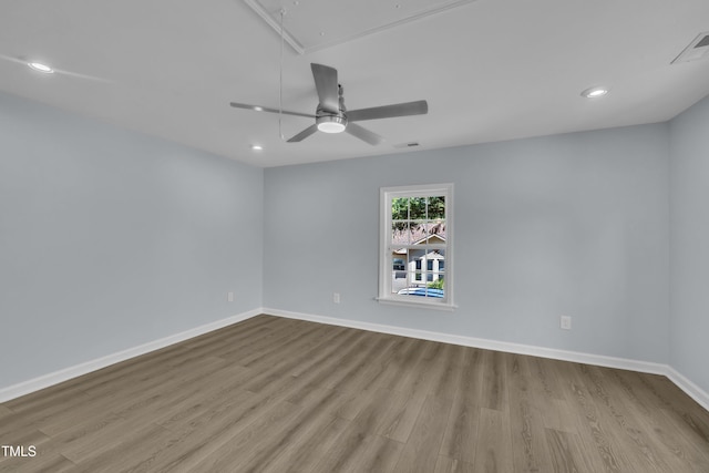 305 W Canary St, Dunn, NC 28334 - spare room with attic access, wood finished floors, recessed lighting, baseboards, and a ceiling fan