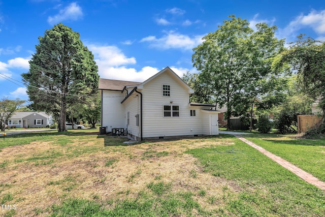 305 W Canary St, Dunn, NC 28334 - view of property exterior with crawl space and a lawn