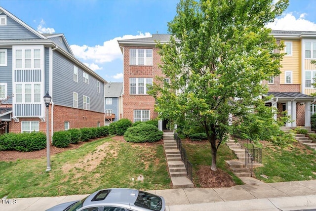229 Michigan Ave, Cary, NC 27519 - view of front facade with stairway and brick siding