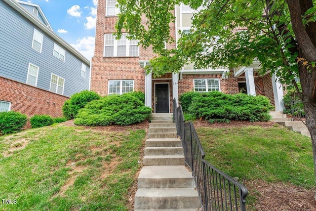 229 Michigan Ave, Cary, NC 27519 - townhome / multi-family property with brick siding and a front yard
