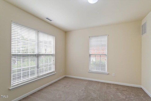 229 Michigan Ave, Cary, NC 27519 - unfurnished room featuring light colored carpet and baseboards