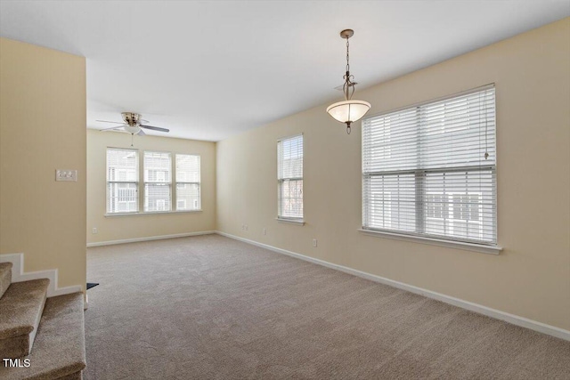 229 Michigan Ave, Cary, NC 27519 - unfurnished room featuring carpet floors, a ceiling fan, baseboards, and stairway