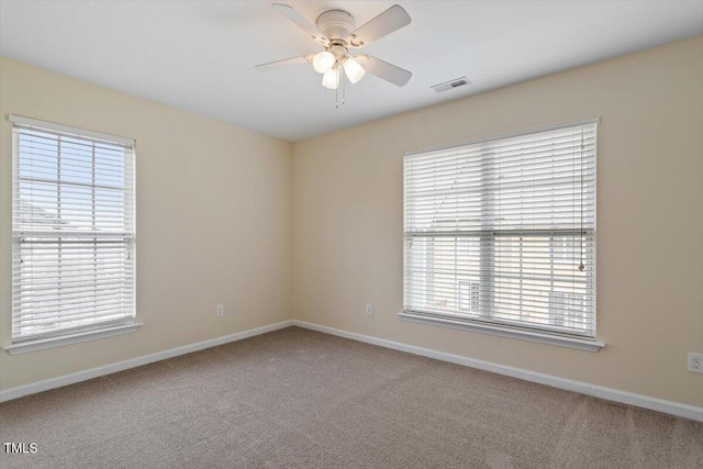 229 Michigan Ave, Cary, NC 27519 - carpeted empty room with baseboards and a ceiling fan