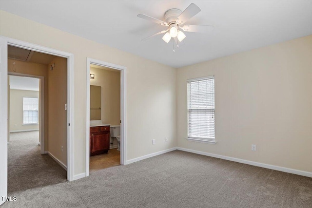 229 Michigan Ave, Cary, NC 27519 - unfurnished bedroom featuring attic access, carpet floors, baseboards, and connected bathroom