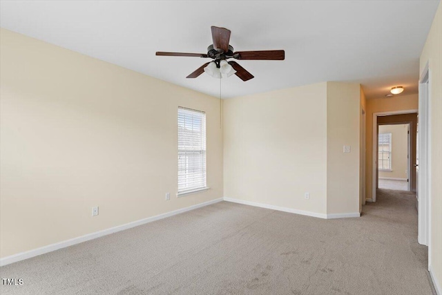229 Michigan Ave, Cary, NC 27519 - spare room with light colored carpet, healthy amount of natural light, a ceiling fan, and baseboards