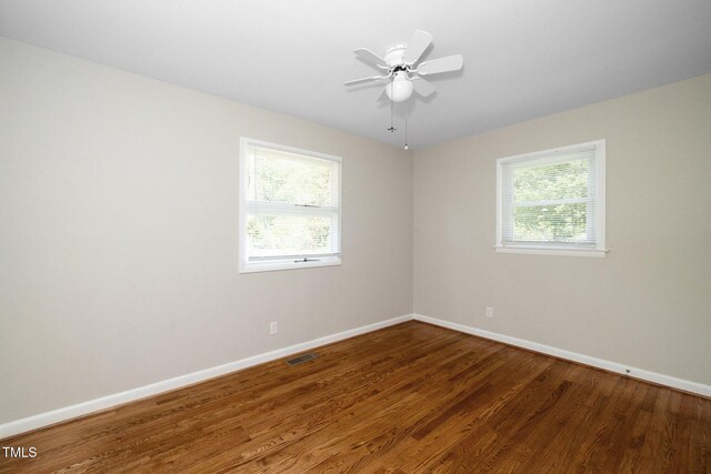 202 Crest Rd, Cary, NC 27513 - unfurnished room with plenty of natural light, baseboards, wood finished floors, and ceiling fan