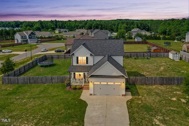 102 Williamson Place Dr, Princeton, NC 27569 - traditional-style home with a trampoline, driveway, roof with shingles, and covered porch