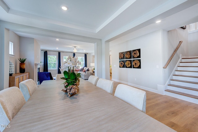 2512 Stonington Dr, Cary, NC 27523 - dining space featuring recessed lighting, light wood-style floors, stairs, baseboards, and ceiling fan