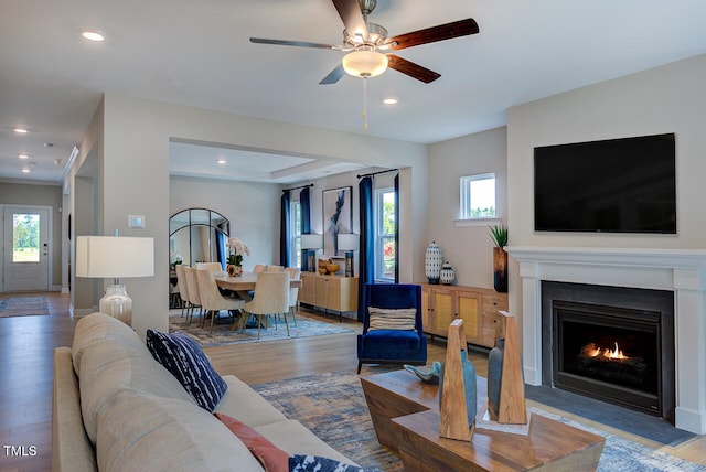 2512 Stonington Dr, Cary, NC 27523 - living area with wood finished floors, healthy amount of natural light, a fireplace with flush hearth, and recessed lighting