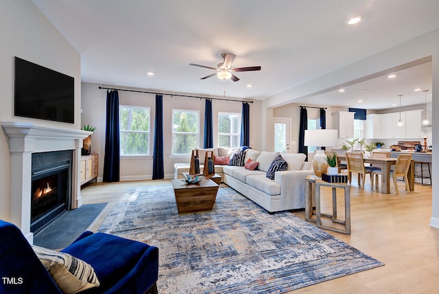 2512 Stonington Dr, Cary, NC 27523 - living room featuring ceiling fan, light wood-style floors, recessed lighting, and a fireplace with flush hearth