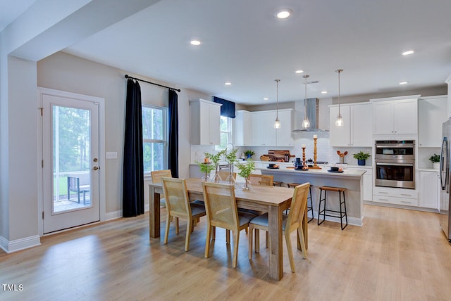 2512 Stonington Dr, Cary, NC 27523 - dining room featuring light wood finished floors, baseboards, and recessed lighting