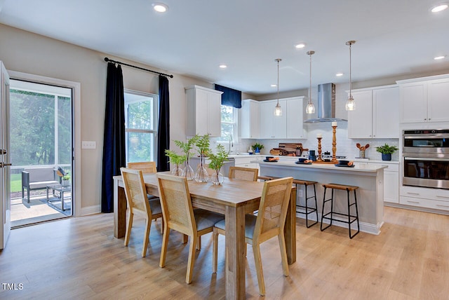 2512 Stonington Dr, Cary, NC 27523 - dining room featuring light wood-type flooring, recessed lighting, and baseboards
