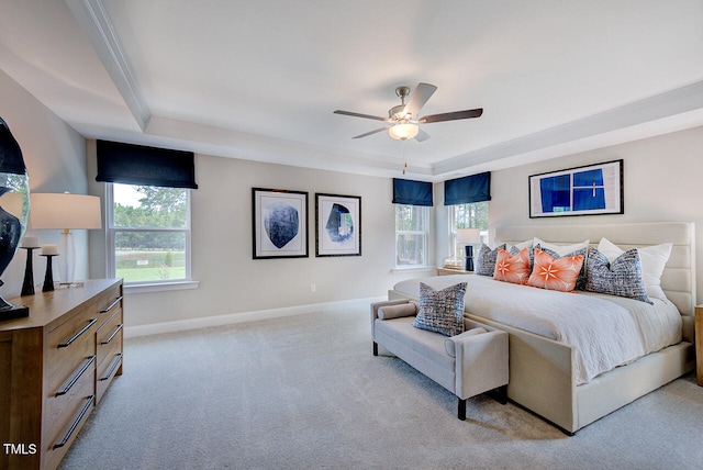 2512 Stonington Dr, Cary, NC 27523 - bedroom featuring multiple windows, light colored carpet, baseboards, a raised ceiling, and ornamental molding