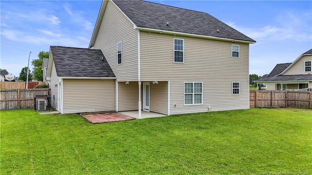 153 Abbey Ln, Raeford, NC 28376 - rear view of property with a patio area, central AC, and roof with shingles
