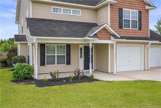 153 Abbey Ln, Raeford, NC 28376 - view of front of house with driveway, a front lawn, a garage, covered porch, and roof with shingles