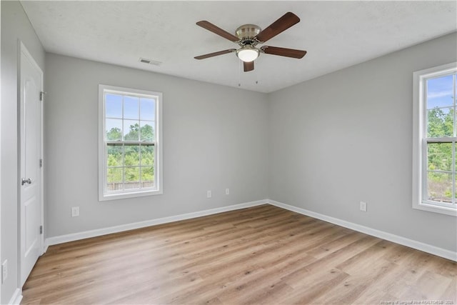 153 Abbey Ln, Raeford, NC 28376 - unfurnished bedroom featuring light wood-style flooring, baseboards, and ceiling fan