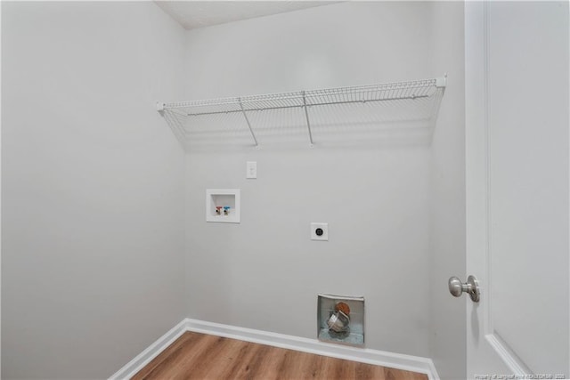 153 Abbey Ln, Raeford, NC 28376 - laundry area featuring hookup for an electric dryer, hookup for a washing machine, wood finished floors, and baseboards