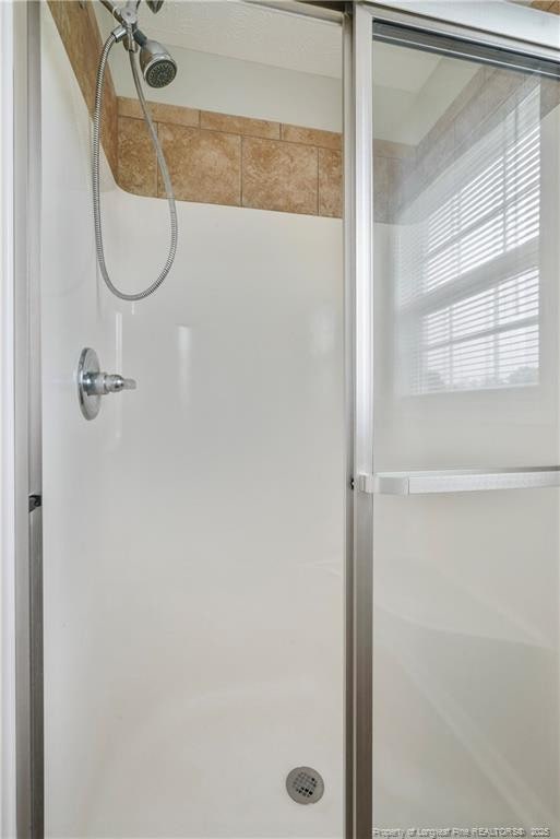 153 Abbey Ln, Raeford, NC 28376 - bathroom with a stall shower