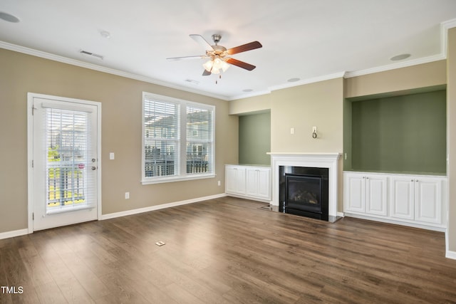 5910 Giddings St, Raleigh, NC 27616 - unfurnished living room with crown molding, ceiling fan, plenty of natural light, dark wood-style floors, and a fireplace with flush hearth
