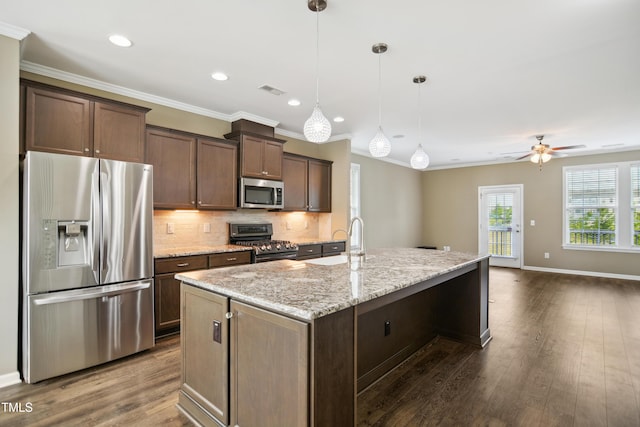 5910 Giddings St, Raleigh, NC 27616 - kitchen with appliances with stainless steel finishes, backsplash, a sink, dark wood-type flooring, and ceiling fan