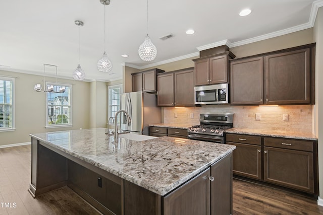 5910 Giddings St, Raleigh, NC 27616 - kitchen with appliances with stainless steel finishes, a sink, dark brown cabinets, decorative backsplash, and crown molding