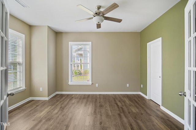 5910 Giddings St, Raleigh, NC 27616 - unfurnished room with wood finished floors, plenty of natural light, a ceiling fan, and baseboards