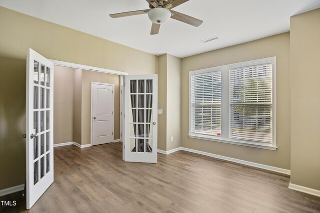 5910 Giddings St, Raleigh, NC 27616 - spare room featuring french doors, wood finished floors, and baseboards