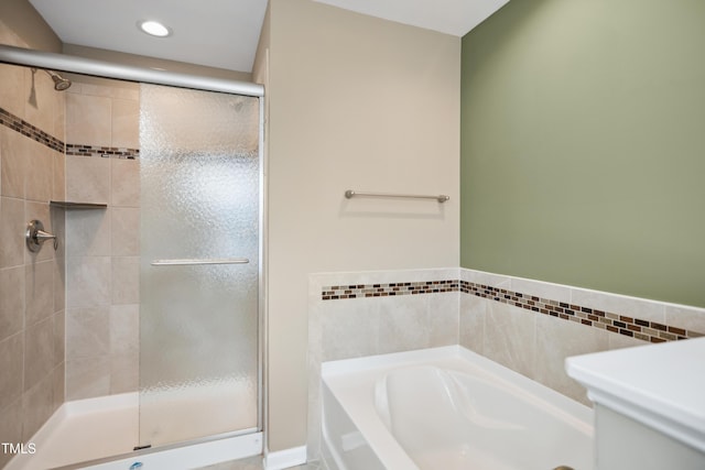 5910 Giddings St, Raleigh, NC 27616 - bathroom with a stall shower, a garden tub, and recessed lighting