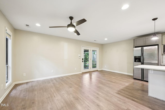 124 Twin Oaks Pl, Cary, NC 27511 - unfurnished living room with light wood-style flooring, recessed lighting, baseboards, and a ceiling fan