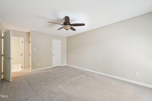124 Twin Oaks Pl, Cary, NC 27511 - unfurnished bedroom with carpet floors, baseboards, and ceiling fan