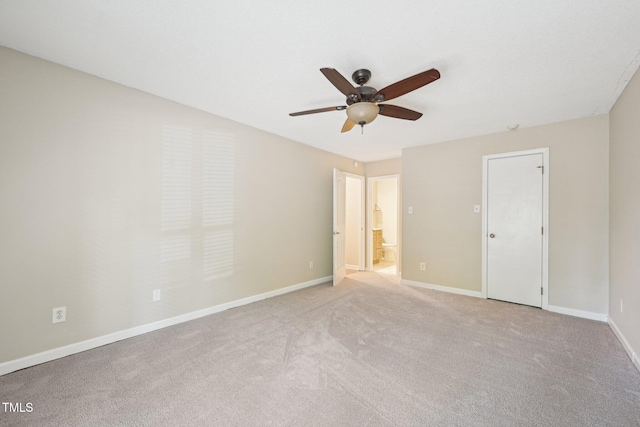124 Twin Oaks Pl, Cary, NC 27511 - unfurnished bedroom with baseboards, ensuite bath, light carpet, and a ceiling fan