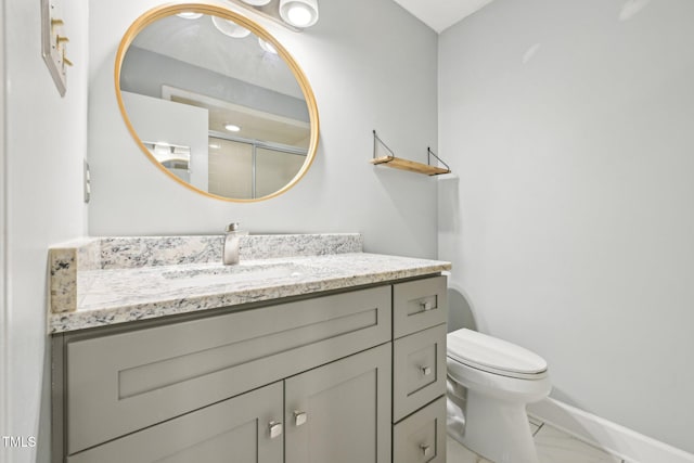 124 Twin Oaks Pl, Cary, NC 27511 - full bathroom featuring vanity, marble finish floors, baseboards, toilet, and an enclosed shower