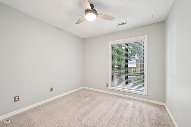 124 Twin Oaks Pl, Cary, NC 27511 - unfurnished room with ceiling fan, light colored carpet, baseboards, and a textured ceiling