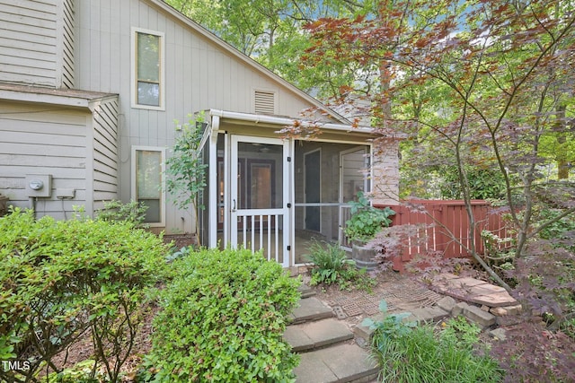 124 Twin Oaks Pl, Cary, NC 27511 - rear view of property with a sunroom