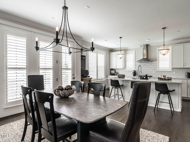 1610 Draper View Loop Unit 101, Raleigh, NC 27608 - dining area with dark wood finished floors, ornamental molding, and a chandelier