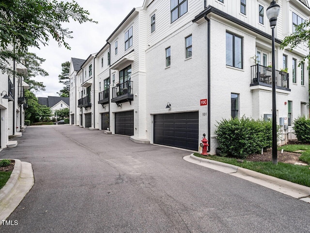 1610 Draper View Loop Unit 101, Raleigh, NC 27608 - view of property featuring a garage and driveway
