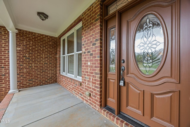 1124 Kalworth Rd, Wake Forest, NC 27587 - view of exterior entry featuring a porch and brick siding